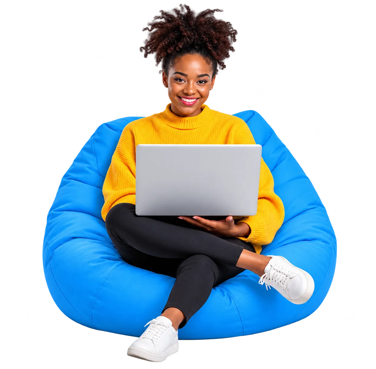 Smiling student using a laptop while seated on a blue beanbag